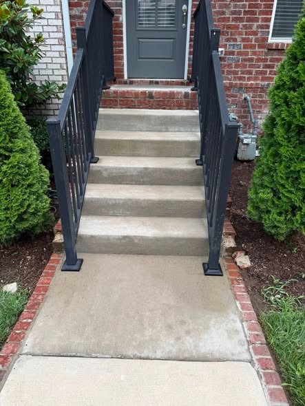 After cleaning brighter concrete steps and entry walkway