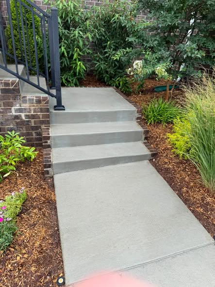 After cleaning concrete steps and landing near landscaping