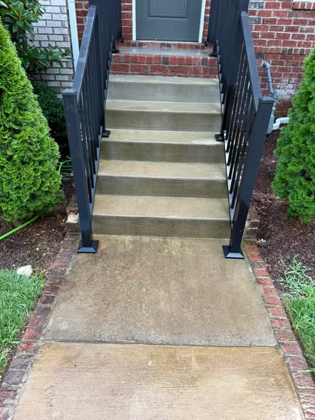 Before cleaning darker concrete steps and entry walkway